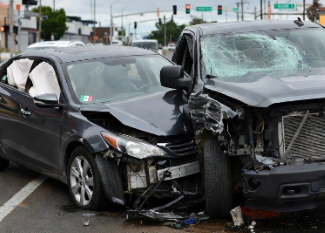 Wrecked car with tricolor flag.png
